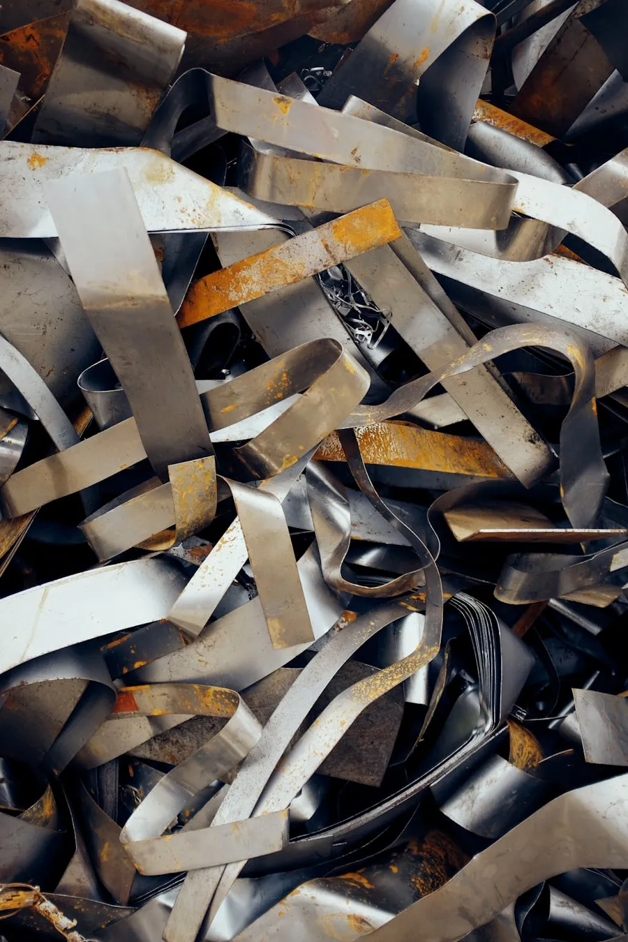 A tangle of twisted steel sheet metal offcuts